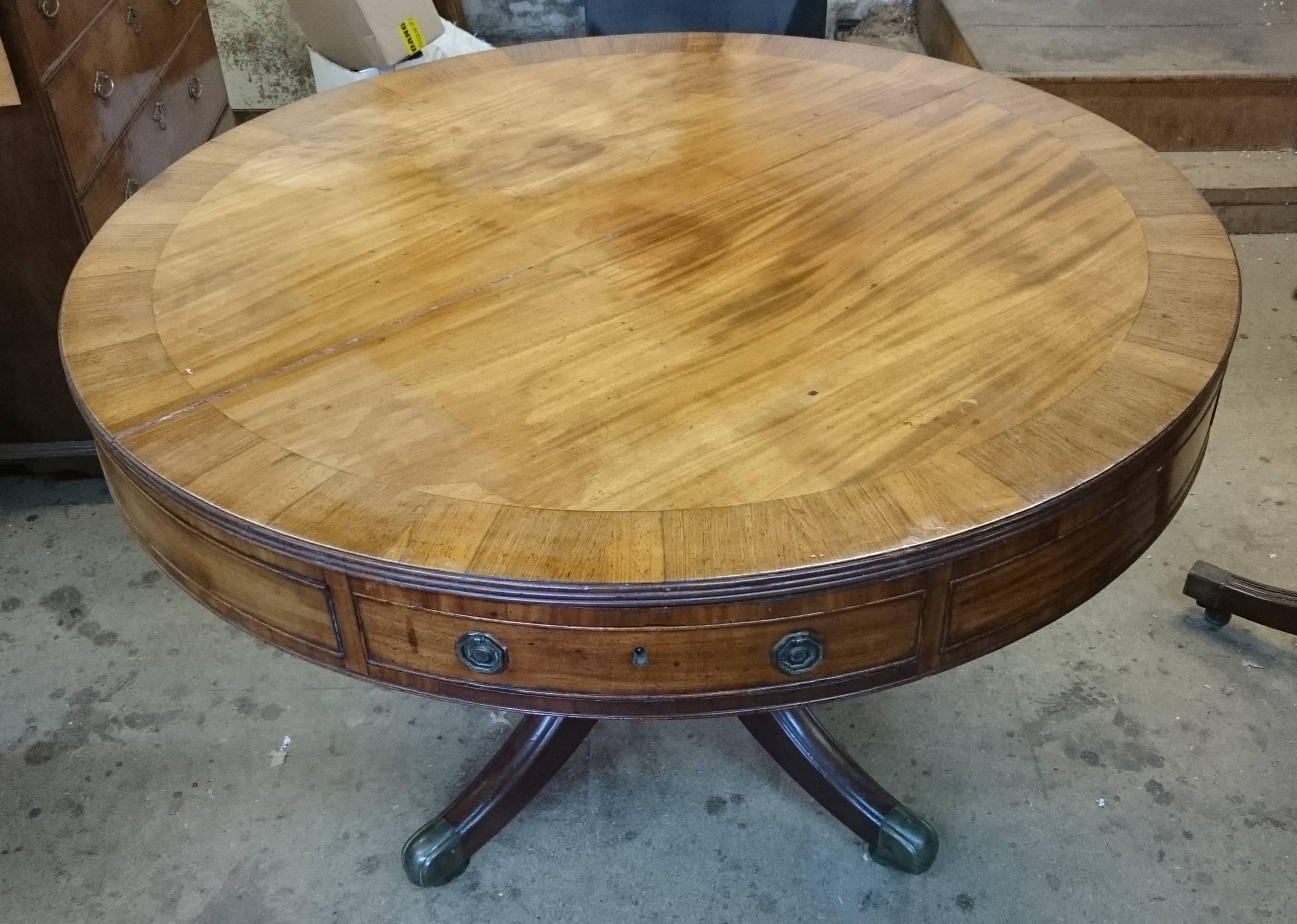 This is a very fine quality 18th century antique library 'drum' table. This library table has a rotating top which means lots of work spread over the writing surface can be accessed by simply spinning the top. The mahogany used to make this library