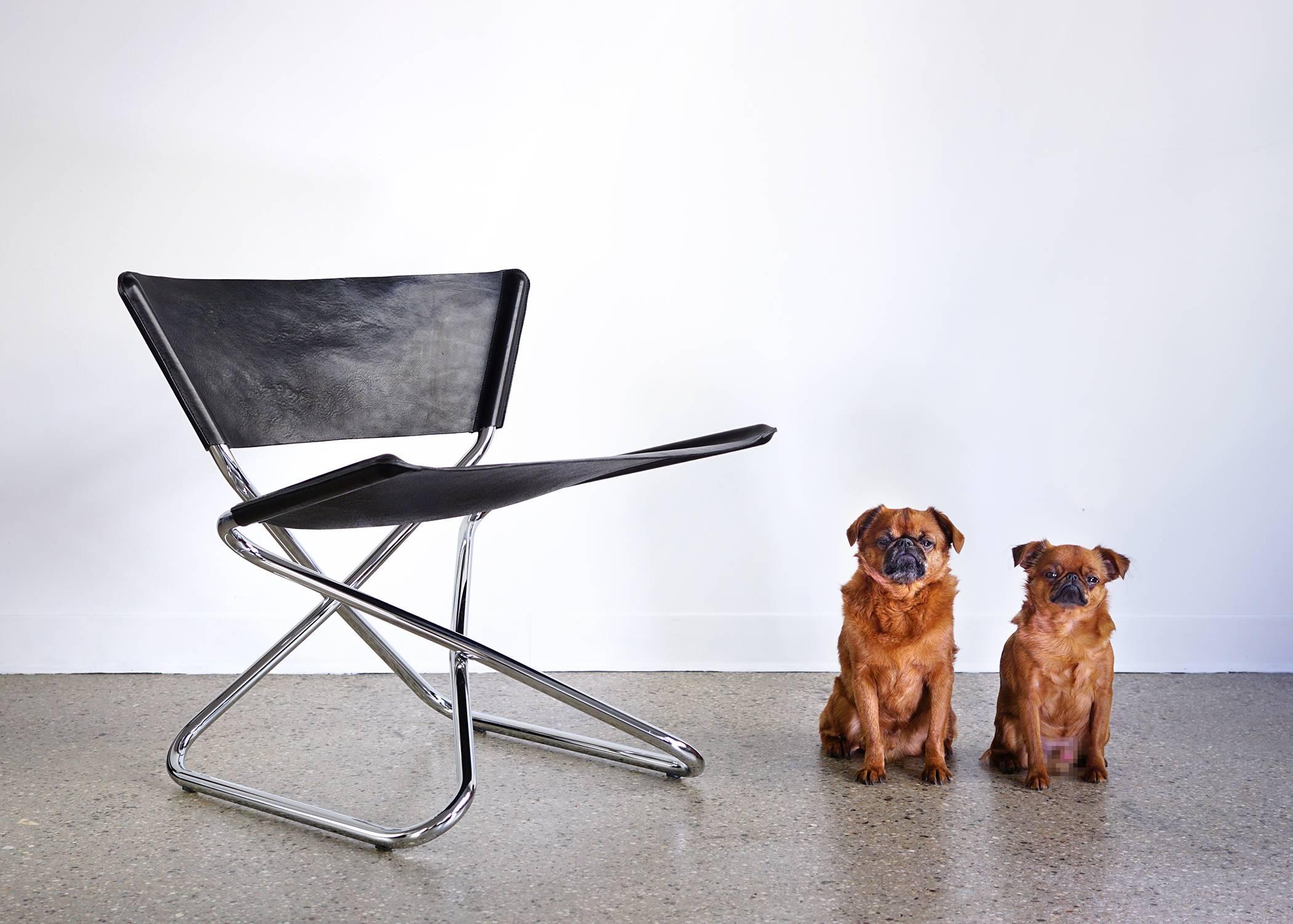 Folding steel tube frame. Thick black leather seat and back. Manufactured in Denmark by Engelbrechts. High quality production.