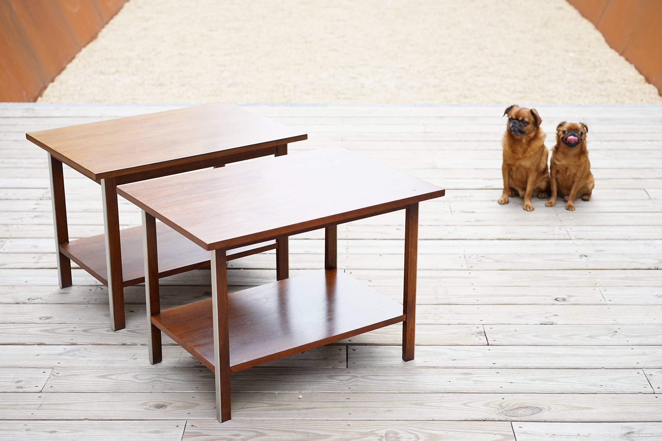 Smart and understated Midcentury walnut tables with contrasting aluminum trim. Warm tone and lovely grain. Model number 487. Manufactured in Grand Rapids, Michigan by Calvin Furniture.