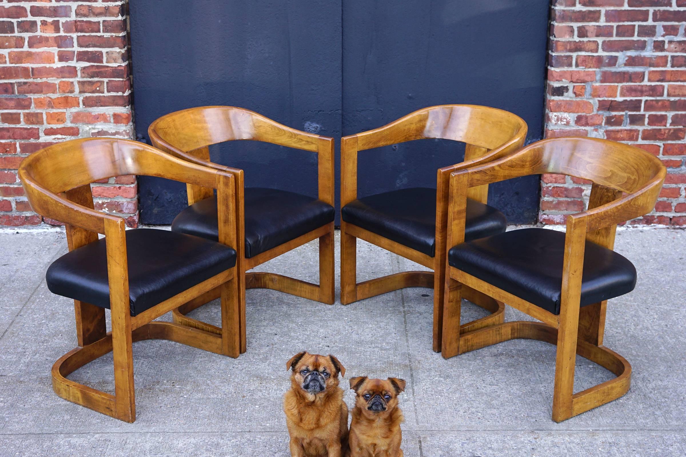 Lovely walnut frames with rich tone and natural patina. Original black leather upholstery. Comfortable, sturdy, and handsome.

Also available $2,800/pair.