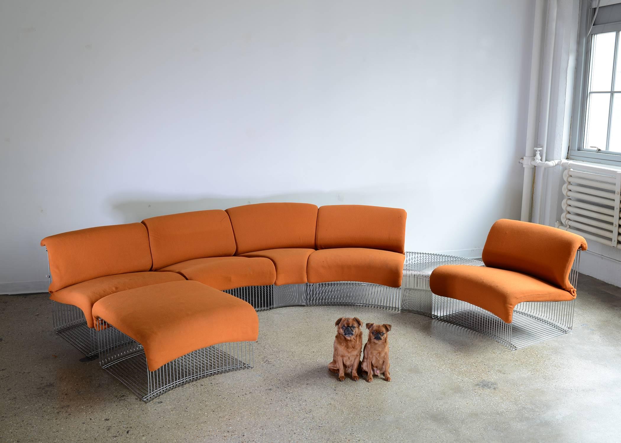 Versatile, sculptural seven piece set. Original orange wool cushions. Designed by Panton for Varna Restaurant, Arhus, in 1971. Manufactured in Denmark by Fritz Hansen.

Set comprised of:
Four chairs (W30.5