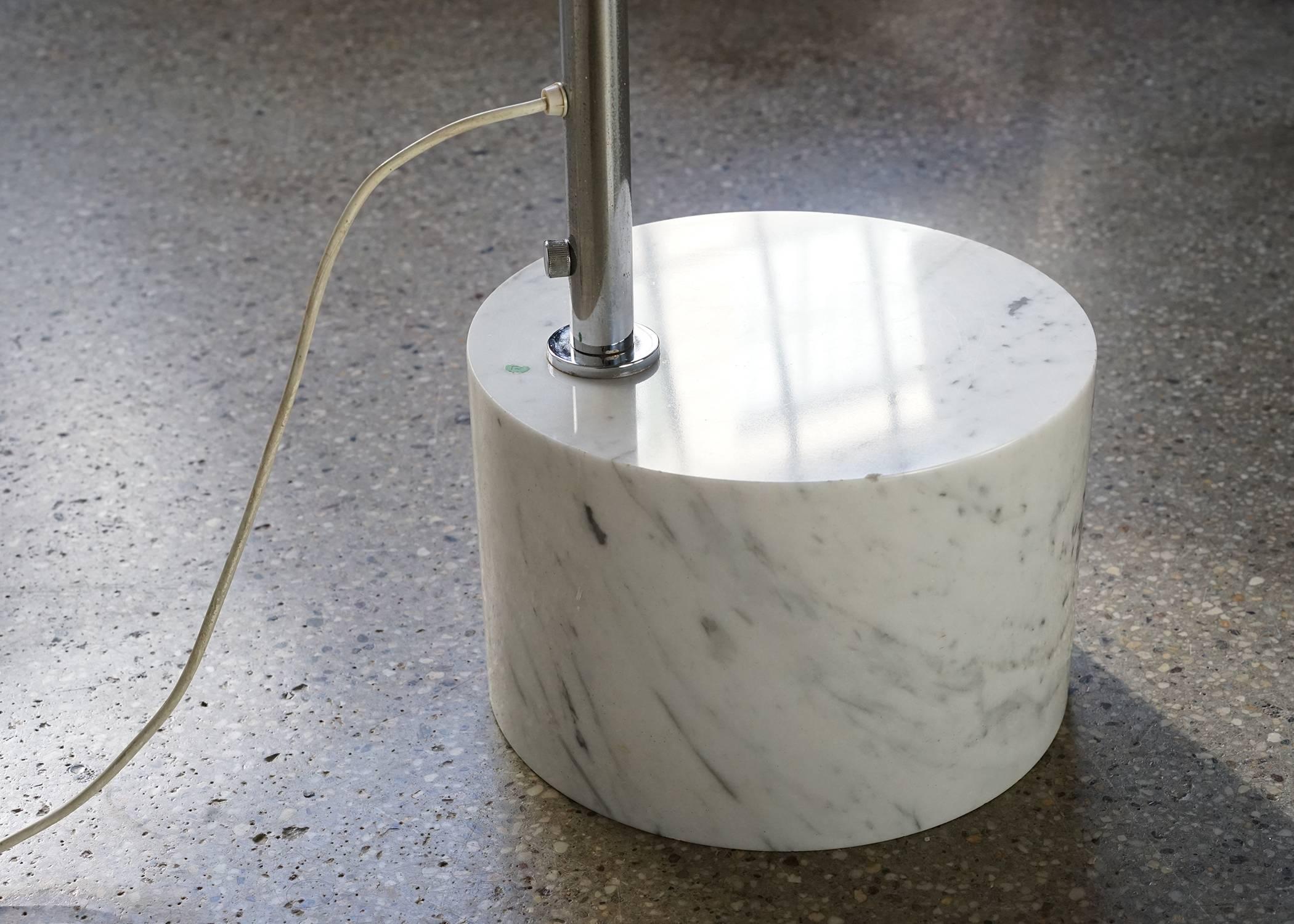 Nice form in fine, vintage condition. Twelve inch diameter chrome plated shade connected by articulating ball joint. White enamel interior to shade, and single medium base socket within. Chrome plated arc has an adjustable height of 80 inches - 102