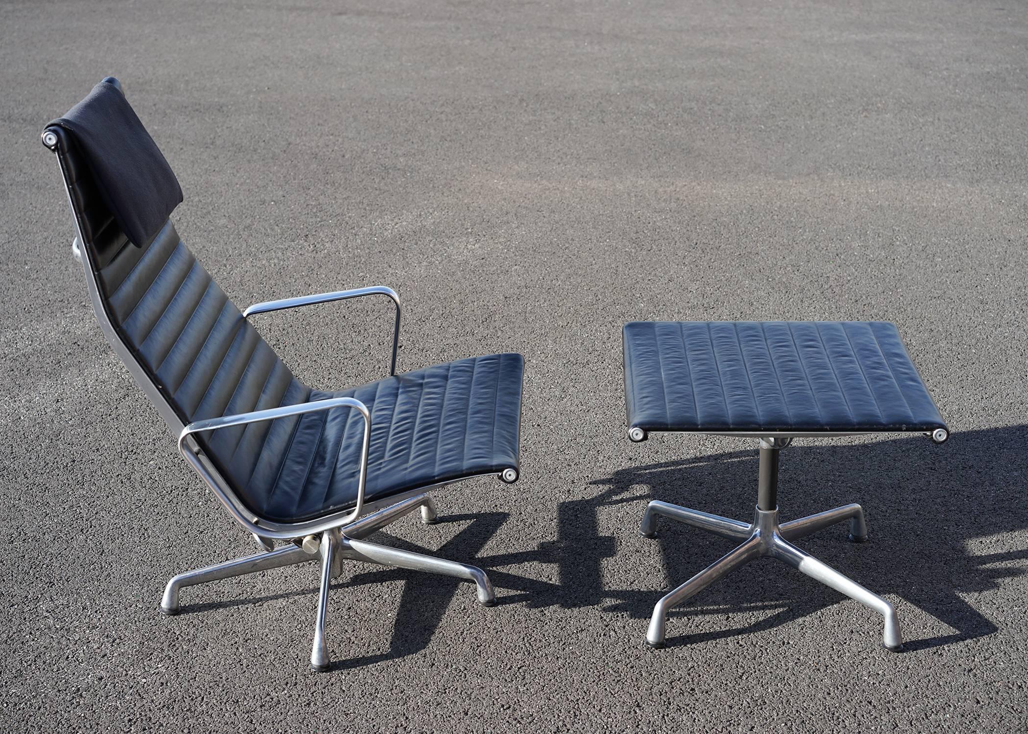 Authentic signed dated and in fine vintage condition. All original. Supple black leather upholstery. Fabric flip-over headrest. Tilt and swivel base. An American Midcentury Classic.

Measures: Chair: H 38.75
