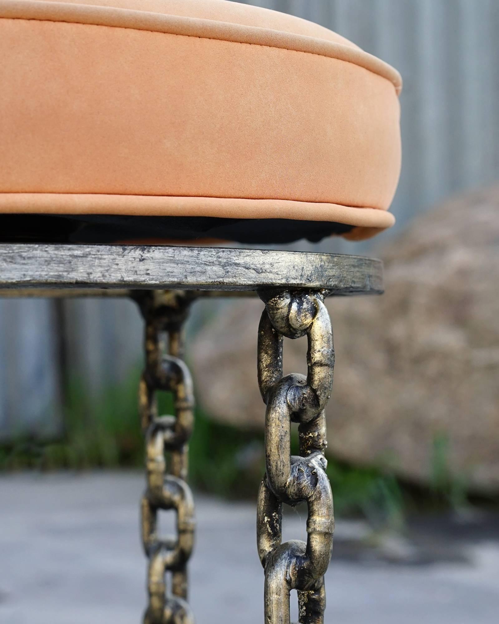Welded chain legs ending in a graceful curve. Swivel upholstered tops with original 1980s peach microfiber fabric. Solid, sturdy, and handsome.