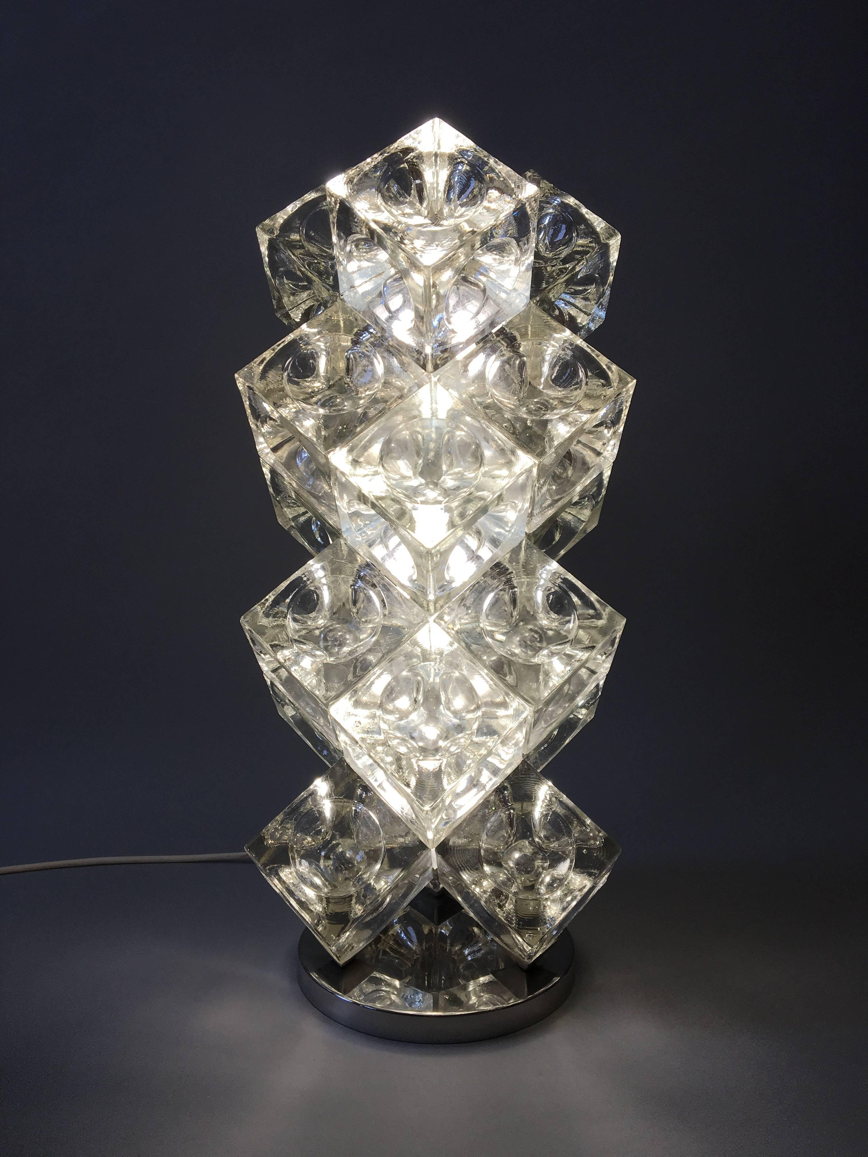 Lamp is made of 18 clear glass cubes with an internal hemispheric groove on a chrome base. There are three internal light bulbs. All original parts.
Follow Frank on Instagram.  Frank.rogin  photos dedicated to Poliarte.