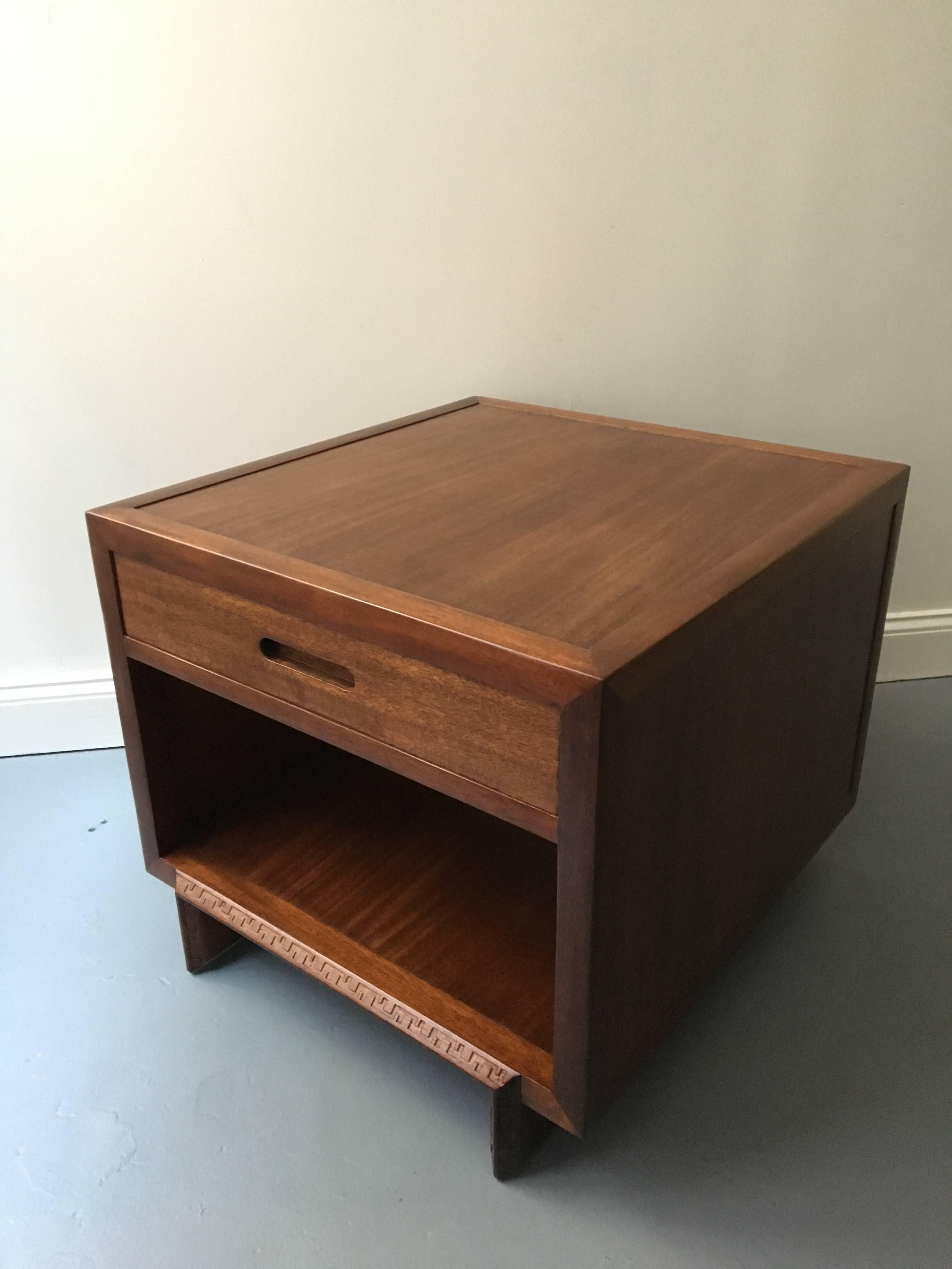 A low table in mahogany made in 1955 by Frank Lloyd Wright. Part of a series of furniture produced by Heritage Henredon. Perfectly proportioned table with internal drawer.