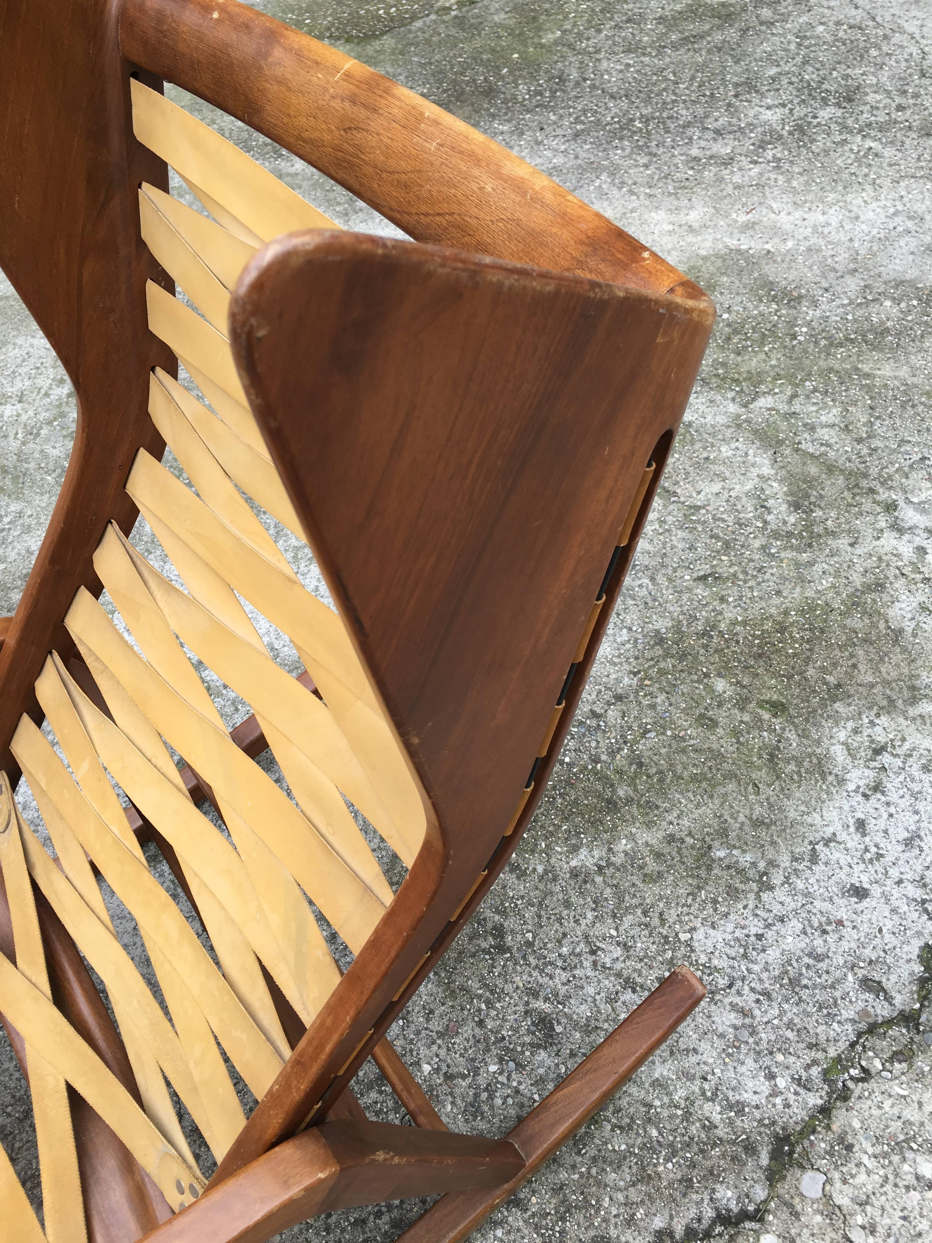 Rocking chair attributed by Gio Ponti. Manufactured by Cassina. The chair is made from walnut, fabric, elasticized banding and plastic. Literature: Irene de Guttry, Maria Paola Maino, Il mobile Italiano degli anni 1940 e 1950, Laterza, Bari, 1992,