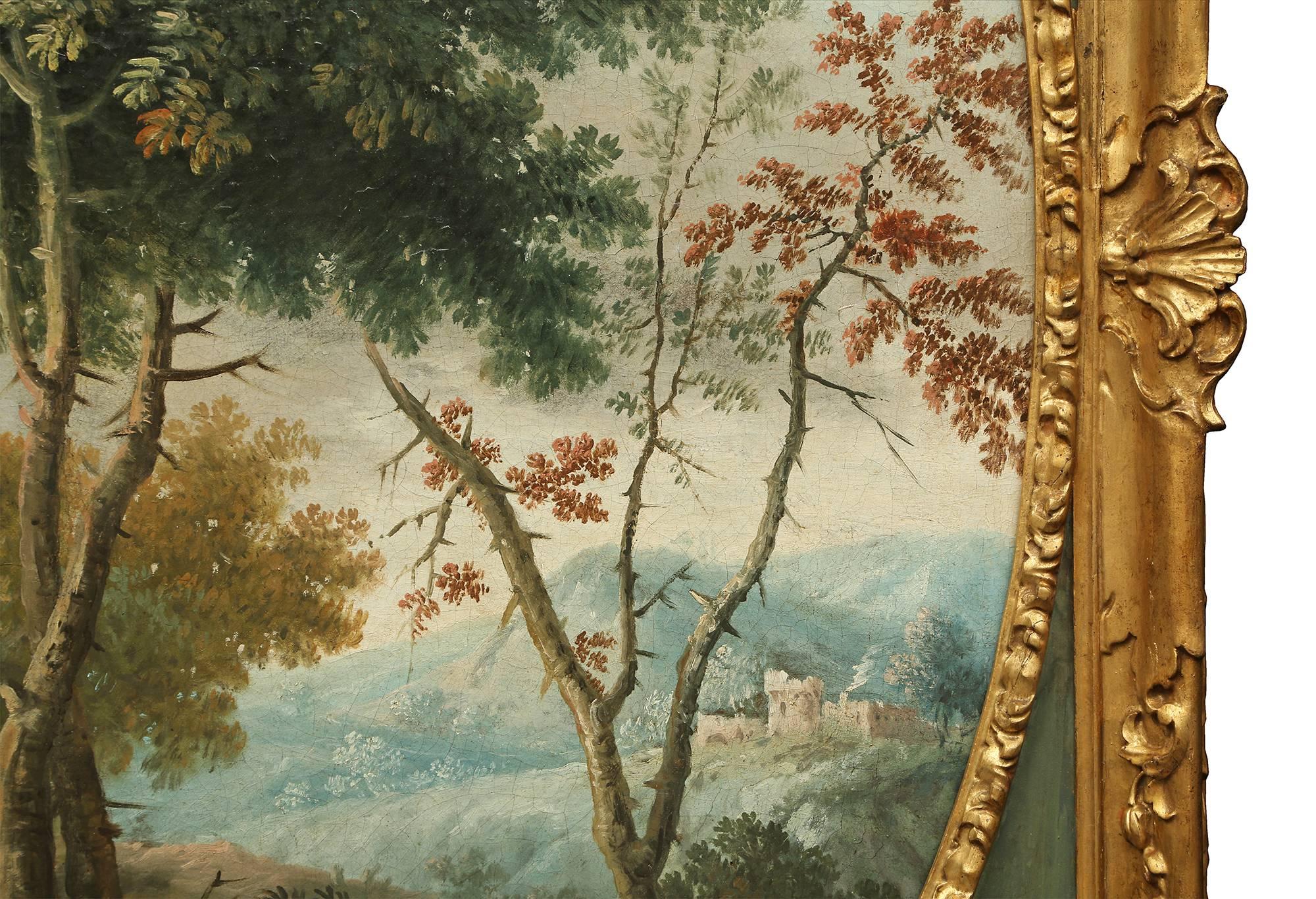 A stunning Italian 18th century neoclassical period oil on canvas of a classical landscape scene set in its original giltwood and patinated frame. The charming oval oil on canvas depicts a lovely landscape with a village in the background and a