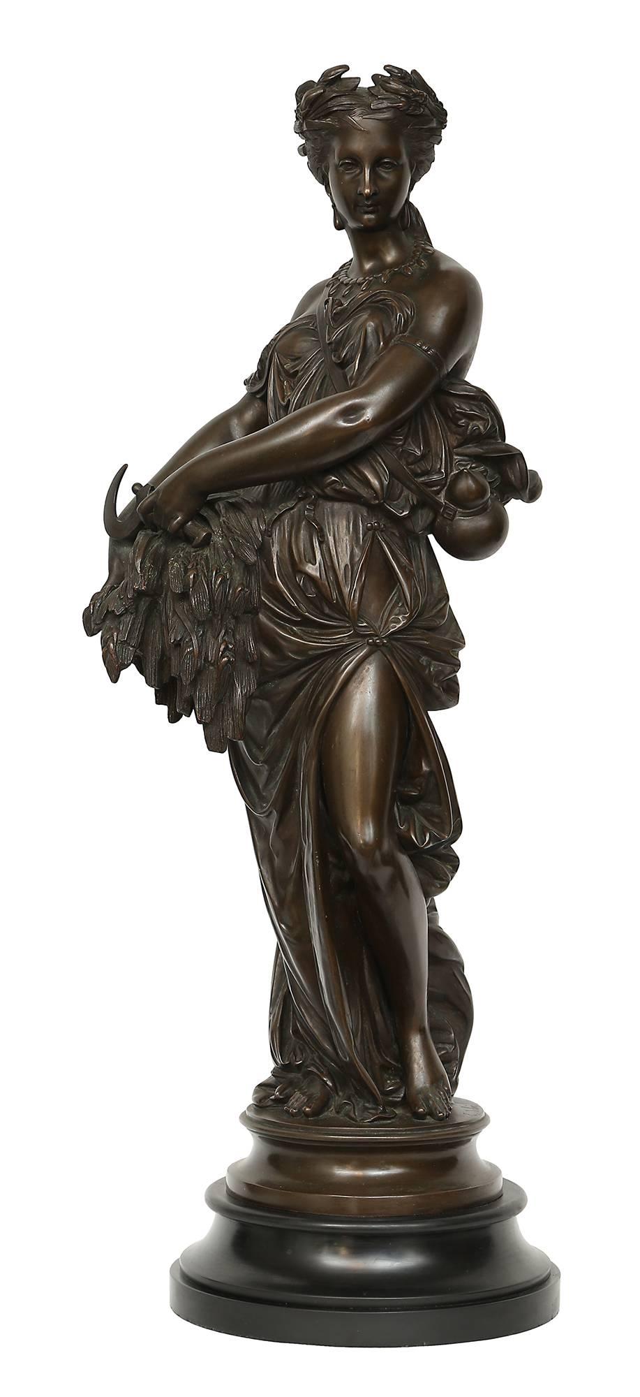 A stunning and high quality true pair of French 19th century bronze statues, signed E. Dubois. Each captivating maiden is raised by a circular mottled black Belgium marble base below the circular bronze support displaying the signature. The maidens