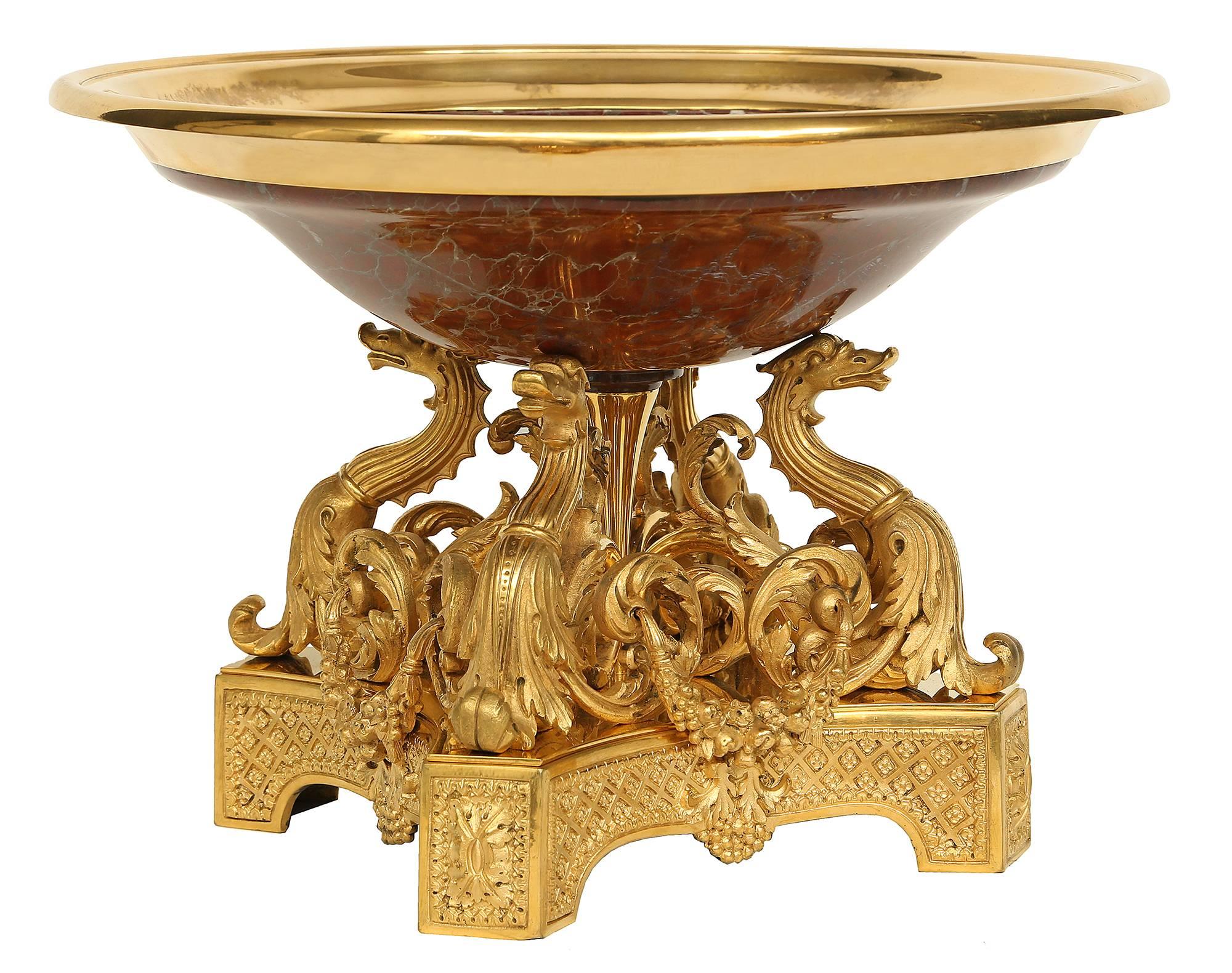 An extremely high quality French 19th century Renaissance style ormolu and marble centerpiece. The centerpiece is raised on square base with concave corners and square feet, each displaying richly chased rosettes in a satin and burnished finish.