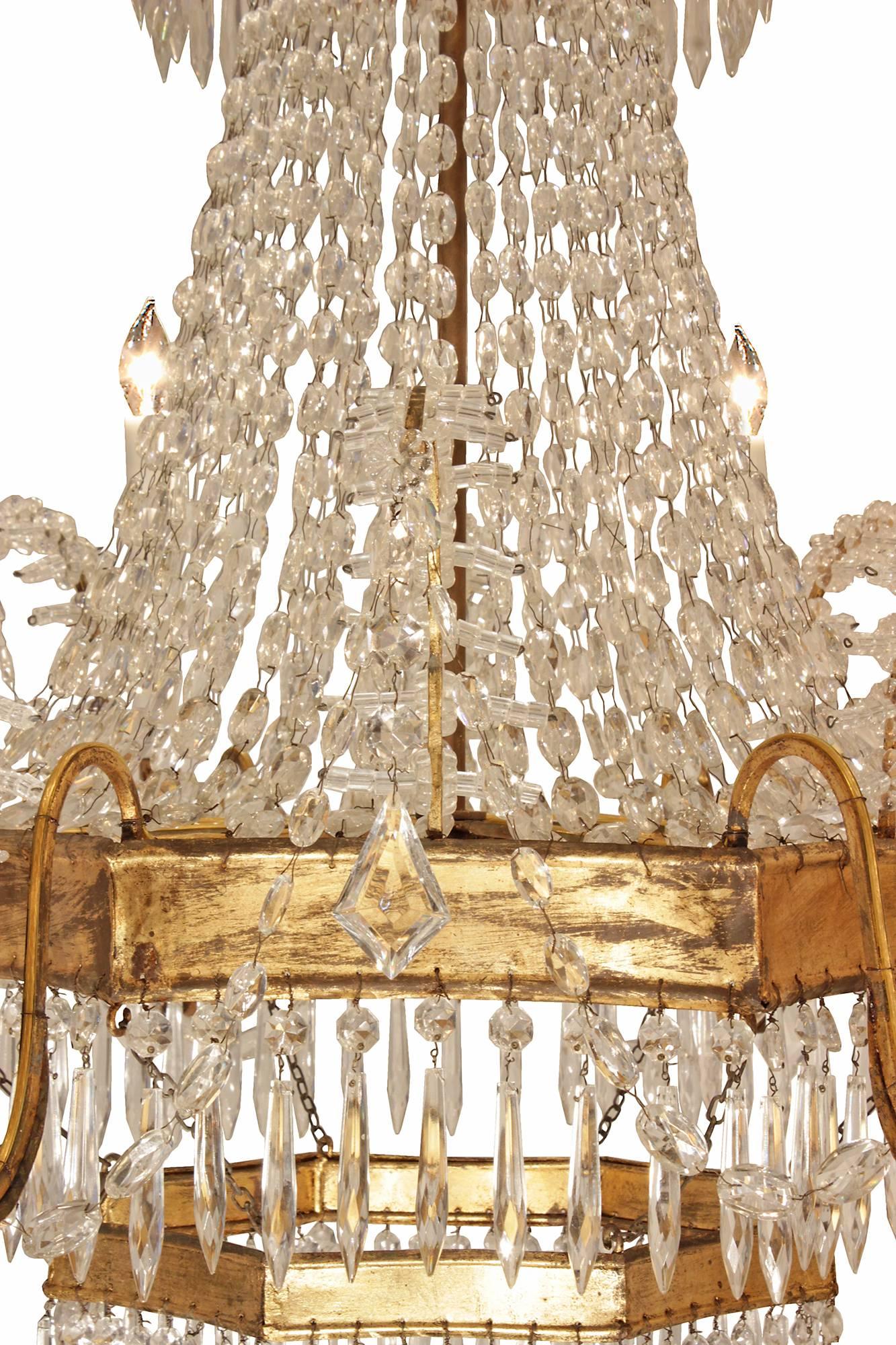 A pair of Italian 19th century gilt metal and crystal eight light chandeliers 1