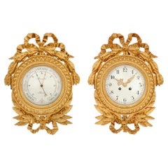 French 19th century Louis XVI st. Giltwood clock and barometer