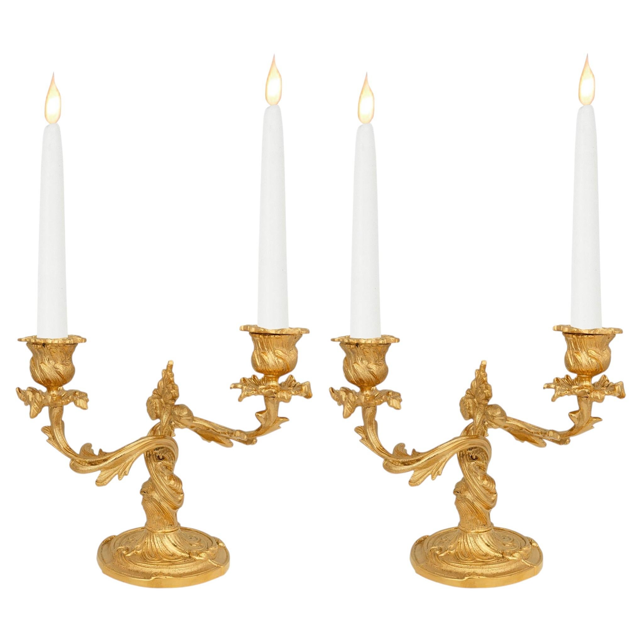 pair of French 19th century Louis XV st. Ormolu candelabras