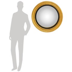 Continental 19th century Giltwood and ebonized Fruitwood convex mirror