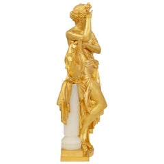 Eine französische Statue im Stil Ludwigs XVI. aus dem 19. Jahrhundert, aus vergoldetem Bronze und Onyx, signiert: A. Carrier