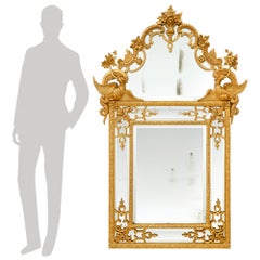 Miroir français en bois doré datant du début du XVIIIe siècle, de l'époque Régence
