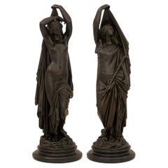 pair of French 19th century patinated Bronze and Marble statues of Night and Day