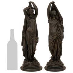 pair of French 19th century patinated Bronze and Marble statues of Night and Day
