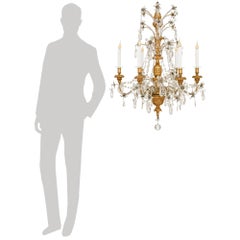 pair of Italian 18th century Giltwood, Crystal and Glass chandeliers, circa 1750