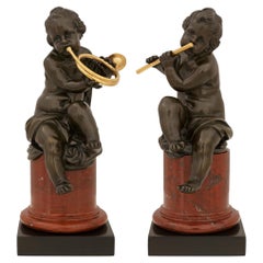 A pair of French 19th century Belle Epoque Period Louis XVI st. marble, patinate