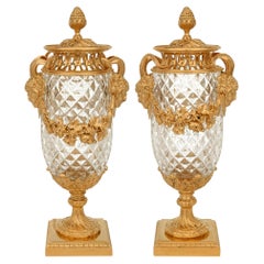 A pair of French 19th century Louis XVI st. Baccarat Crystal and Ormolu urns