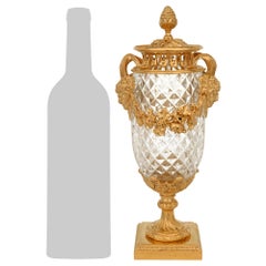 A pair of French 19th century Louis XVI st. Baccarat Crystal and Ormolu urns