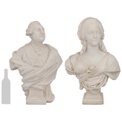 A pair of Italian Carrara marble busts of Louis XVI and Marie Antoinette