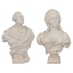A pair of Italian Carrara marble busts of Louis XVI and Marie Antoinette