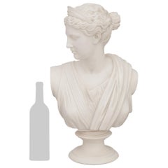 An Italian mid 19th century Grand Tour Period white Carrara marble bust of Diana