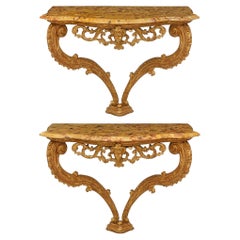 pair of French 18th century Giltwood and Breche D'Alep marble consoles