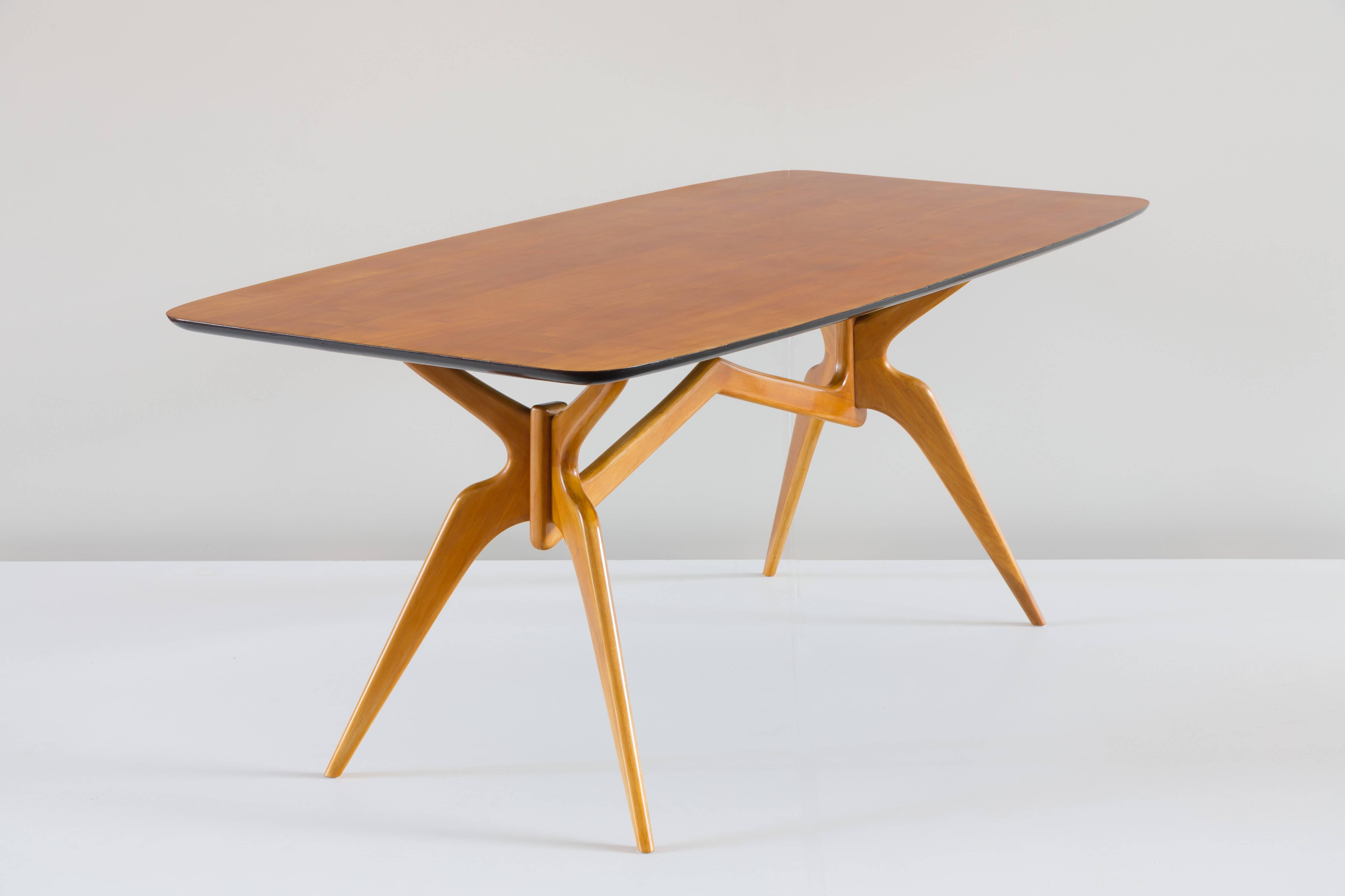 Rare dining table attributed to Ico Parisi, circa 1950. 
Very stylish legs.
Probably executed by Colombo, Cantu.
Maple wood and walnut. 
Good condition. 
Measures: H 79 cm 184 x 93 cm; height top 3cm.
 