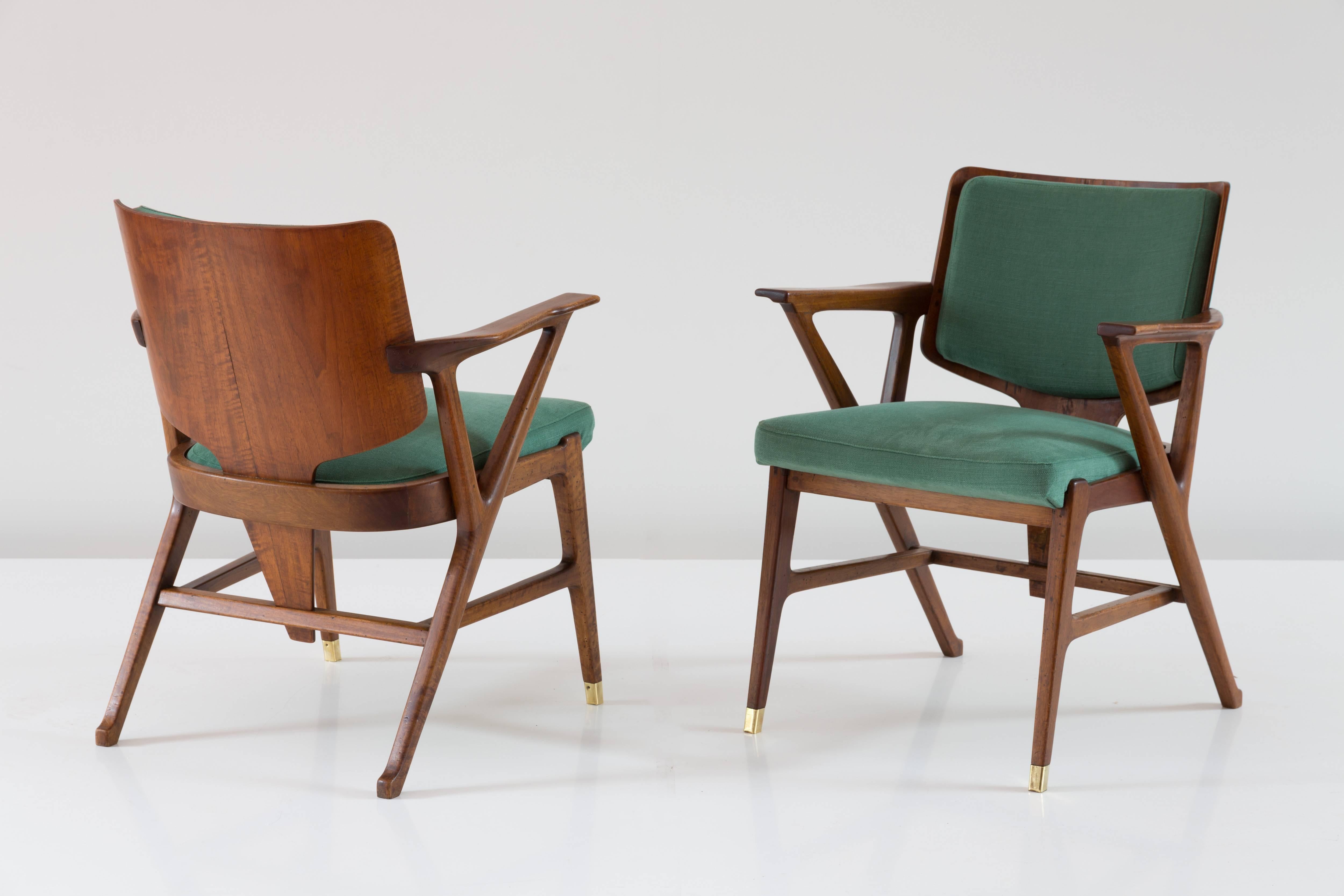 Pair of rare armchairs designed by Arch Enrico Ciuti, 1950.
manufactured by F.lli Cassina. 

walnut, brass, olive green cotton. 
Two brass sabot each armchair.
Very good original condition.
Re-upholstered with olive green cotton.
Measures: H