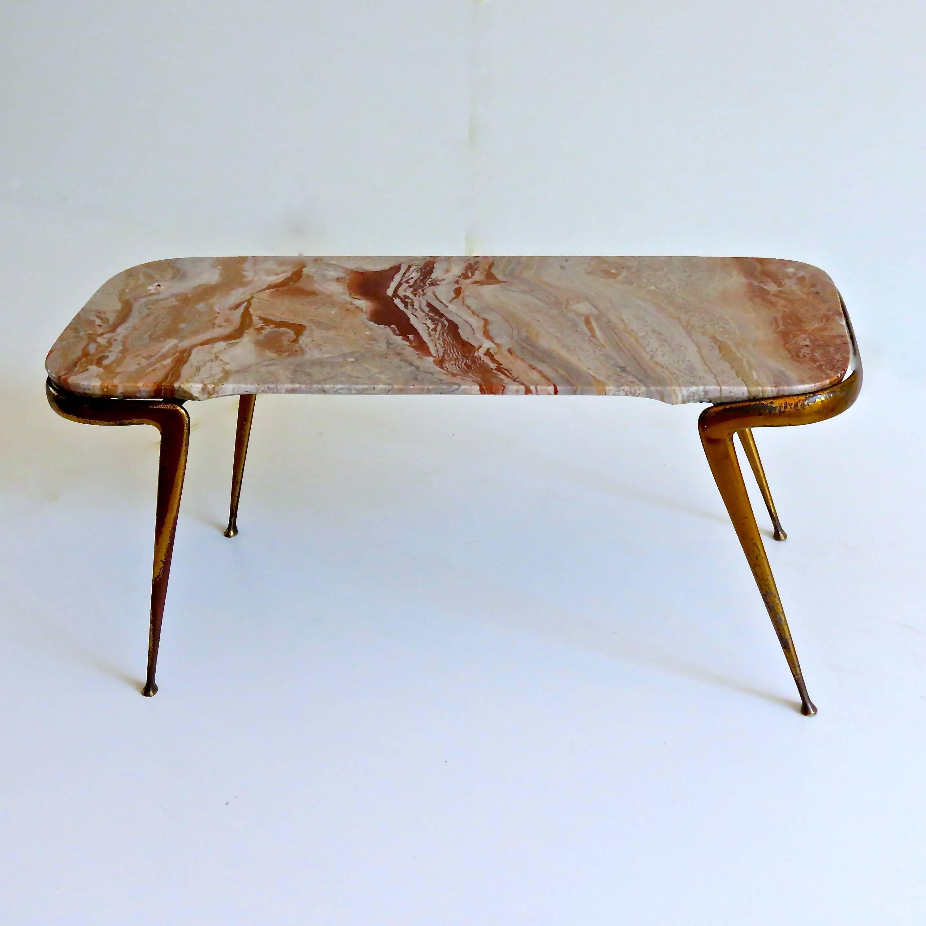 Fine occasional table designed by Cesare Lacca, circa 1950
Brass legs, Italian breccia marble-top
Good condition, some little scratch in the brass
Measures: H 41 cm 92 x 43 cm.
 