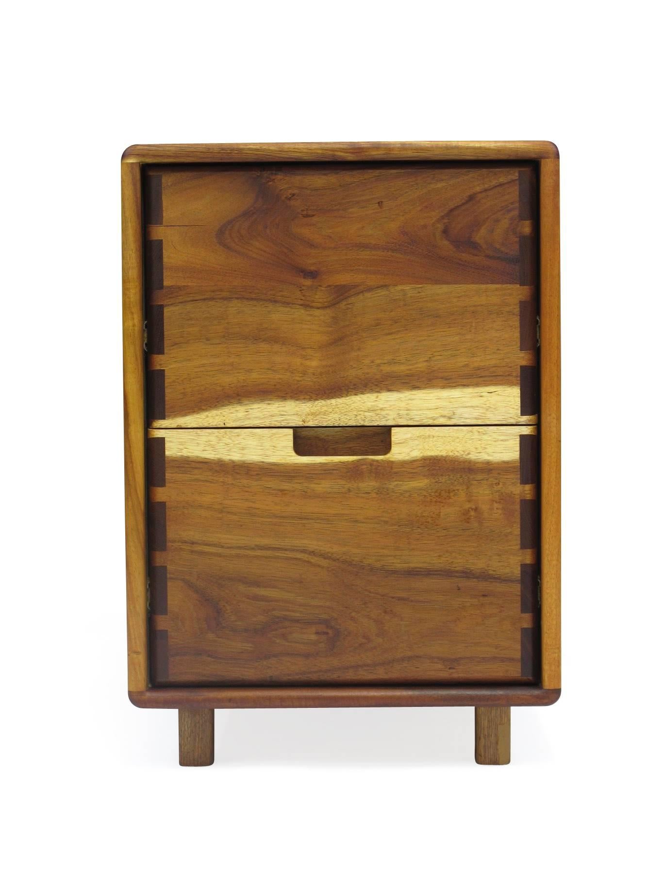 Filing cabinet of solid Koa with exposed joinery by Jim Sweeney. 
