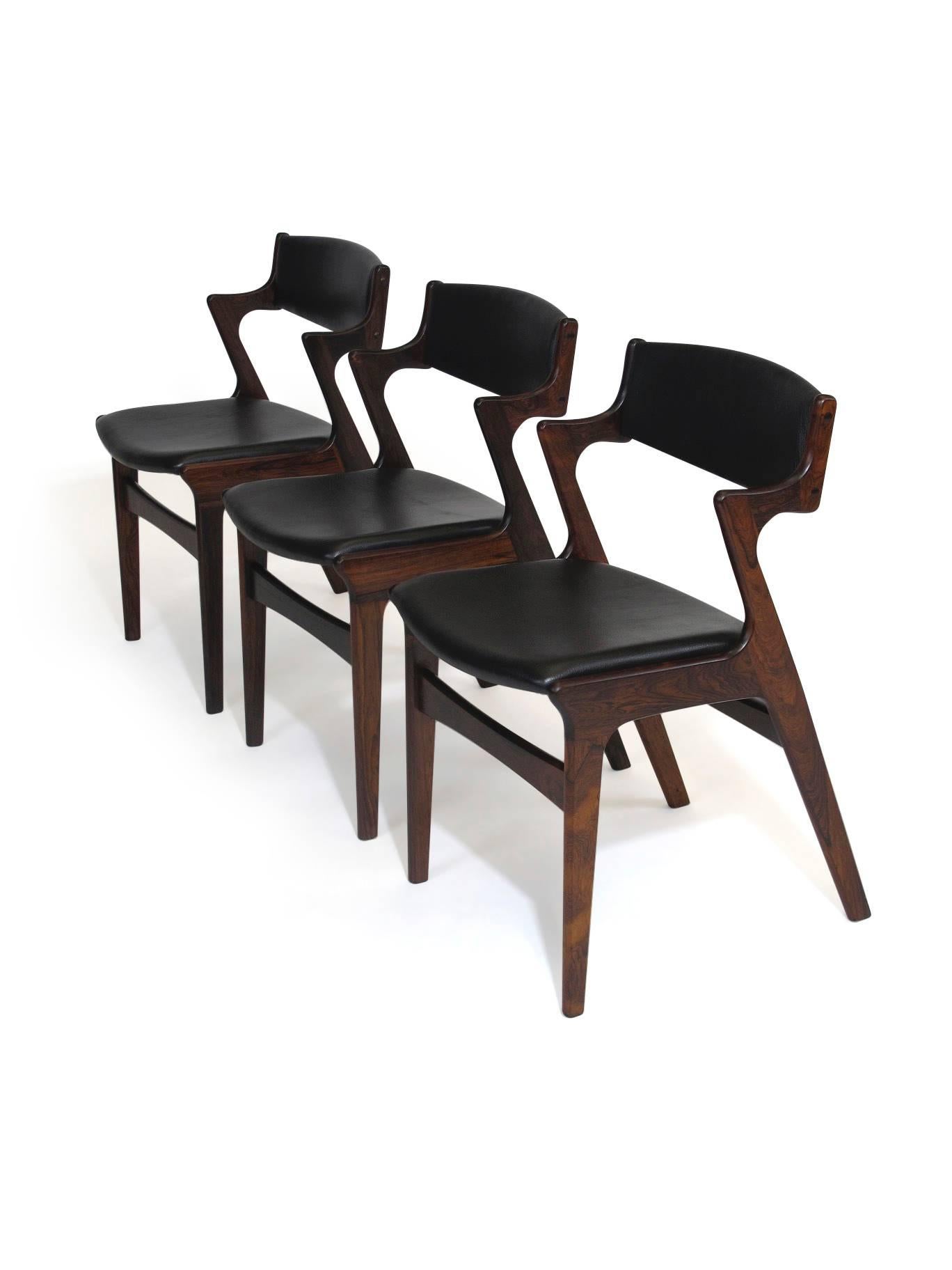 Four Danish Rosewood and Black Leather Dining Chairs In Excellent Condition In Oakland, CA