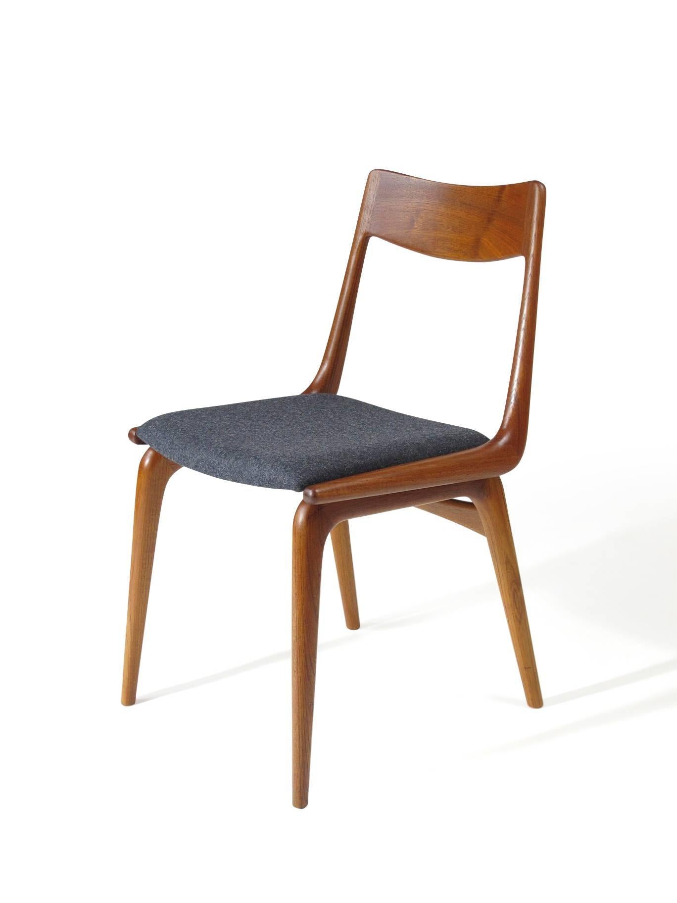 Mid-Century dining chairs designed Erik Christiansen for Slagelse. Solid teak frames in boomerang form with finger joinery and newly upholstered seats in grey wool. Chairs are fully restored and in a excellent condition.

