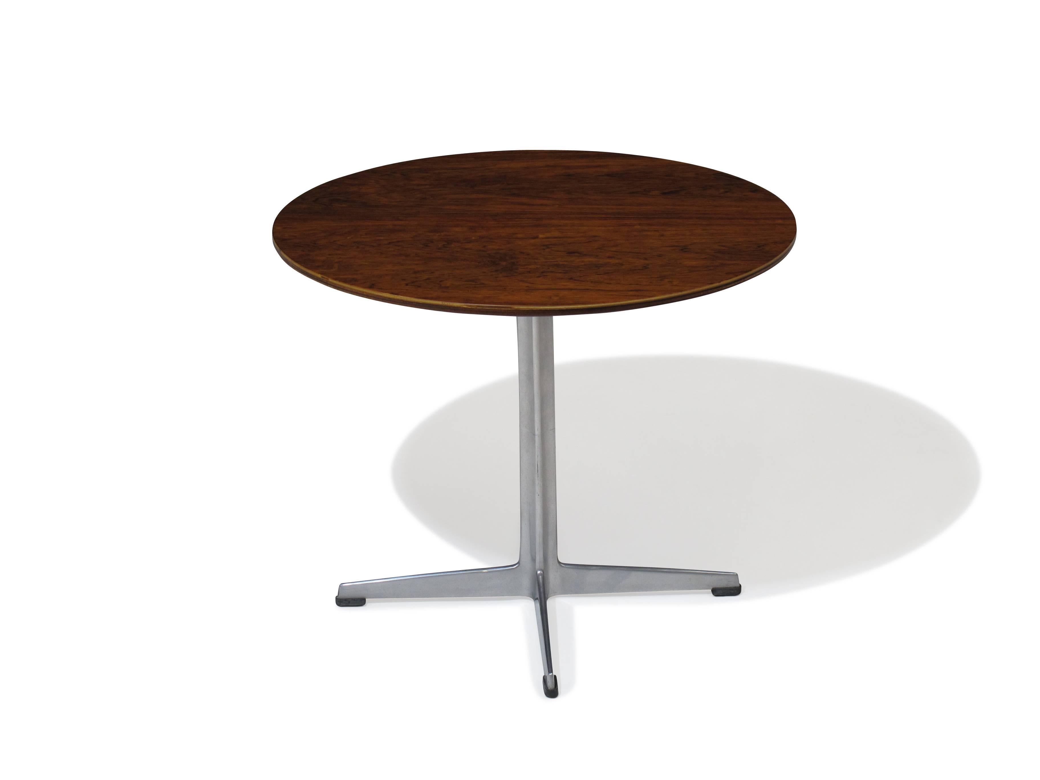 Rosewood table on aluminum base designed by Arne Jacobsen for Fritz Hansen, Denmark.