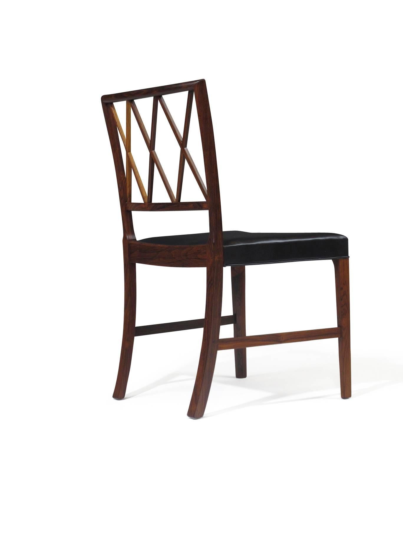 Six Brazilian rosewood dining chairs designed by Ole Wanscher for A.J. Iversen in 1942. Perfectly restored and upholstered in fine black leather.