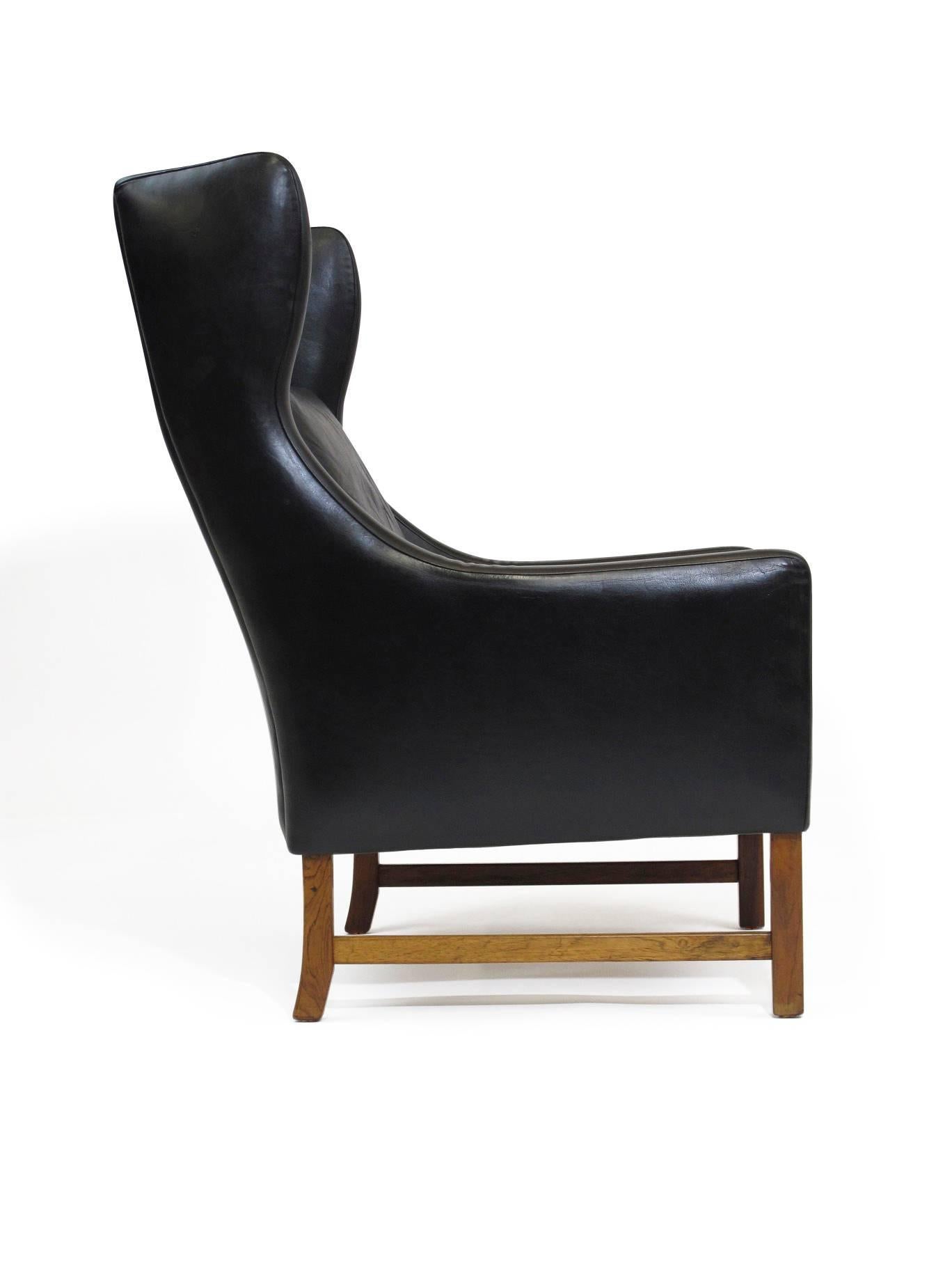 Oiled Fredrik Kayser Rosewood and Black Leather High-Back Danish Lounge Chair