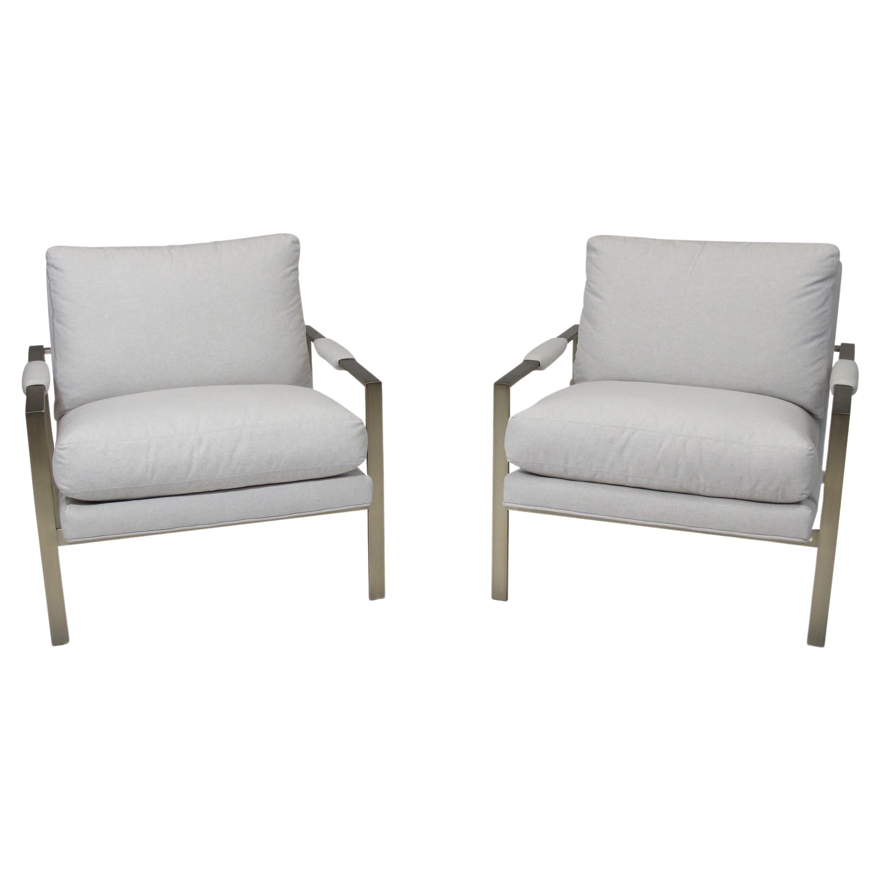 Classic Milo Baughman for Thayer Coggin lounge chairs in a brushed brass finish and off-white upholstered cushions.   Excellent condition. 


 