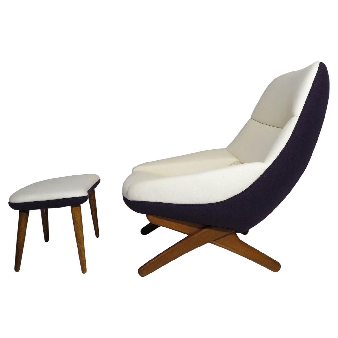 Illum Wikkelsø Danish lounge chair and ottoman, produced by A. Mikael Laursen, circa 1959, Denmark. Model ML91. Reupholstered in aubergine and off-white wool, and supported by aged oak legs.
Measurements
W 34