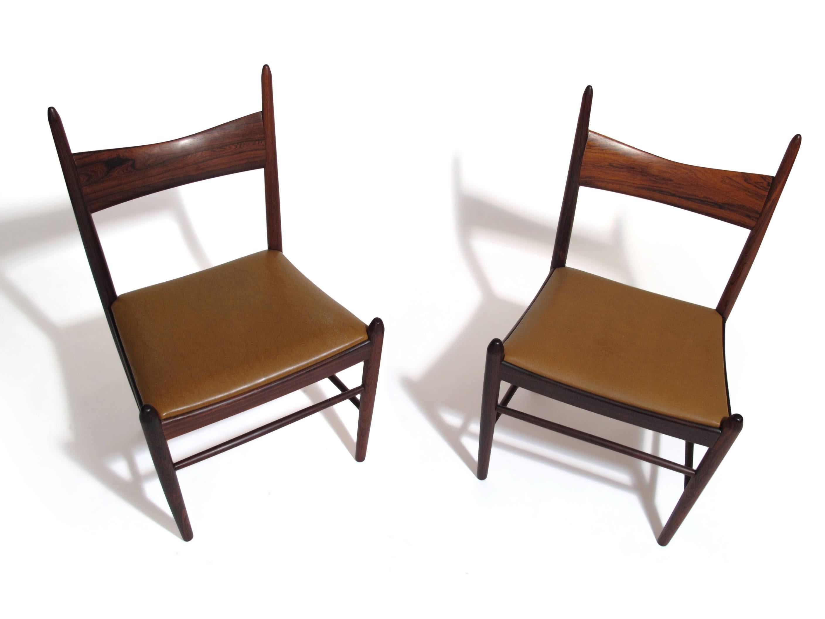 Rosewood dining chairs designed by Vestervig Eriksen for Brdr, Tromborg, Denmark. Handcrafted solid Brazilian rosewood with sculpted back and turned legs. Strong construction and sturdy. 16 available.

Price includes upholstery in choice of material.