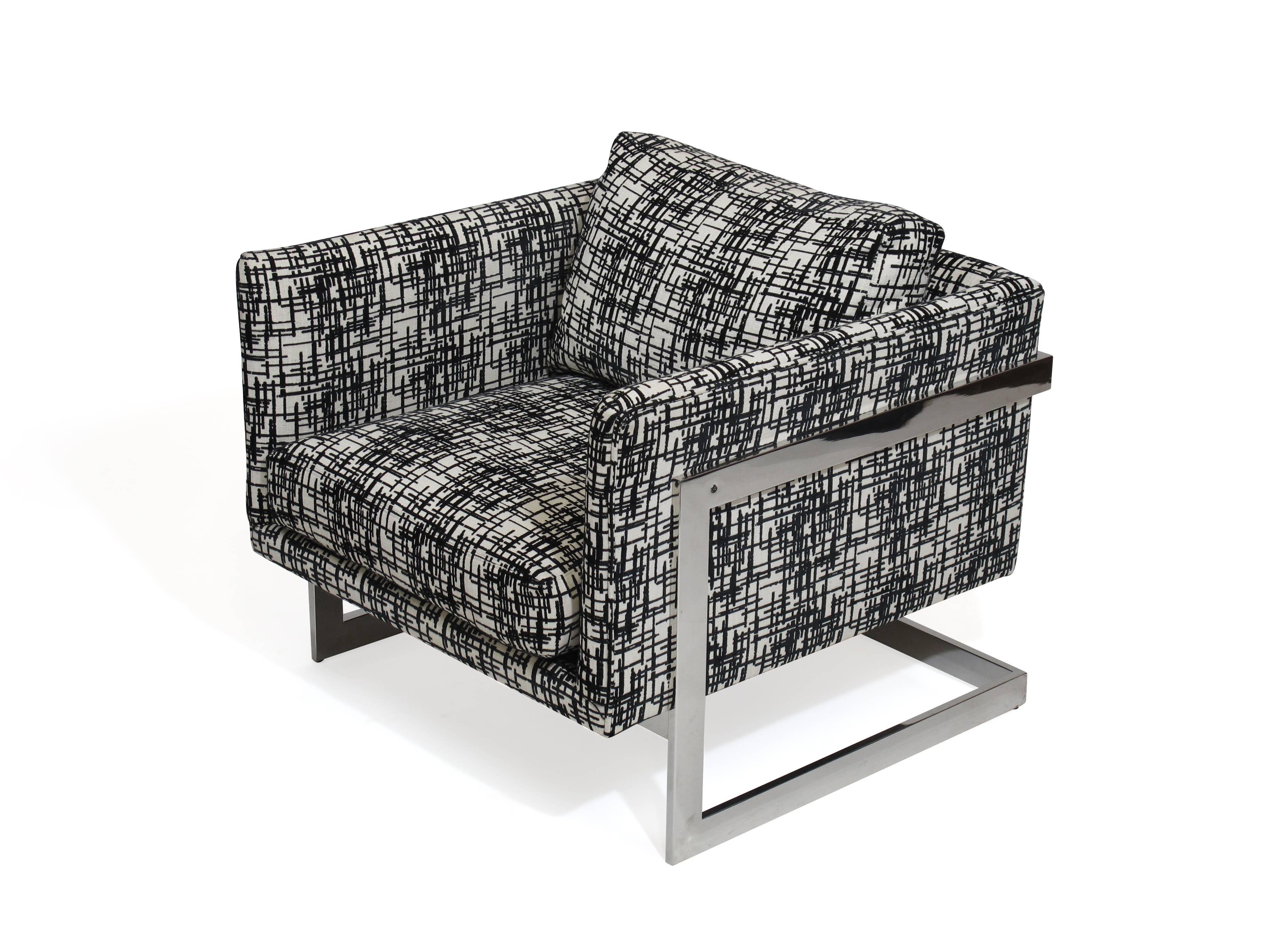 Lounge chair designed by Milo Baughman for Thayer Coggin. Stainless steel frame upholstered in black/white print textile.