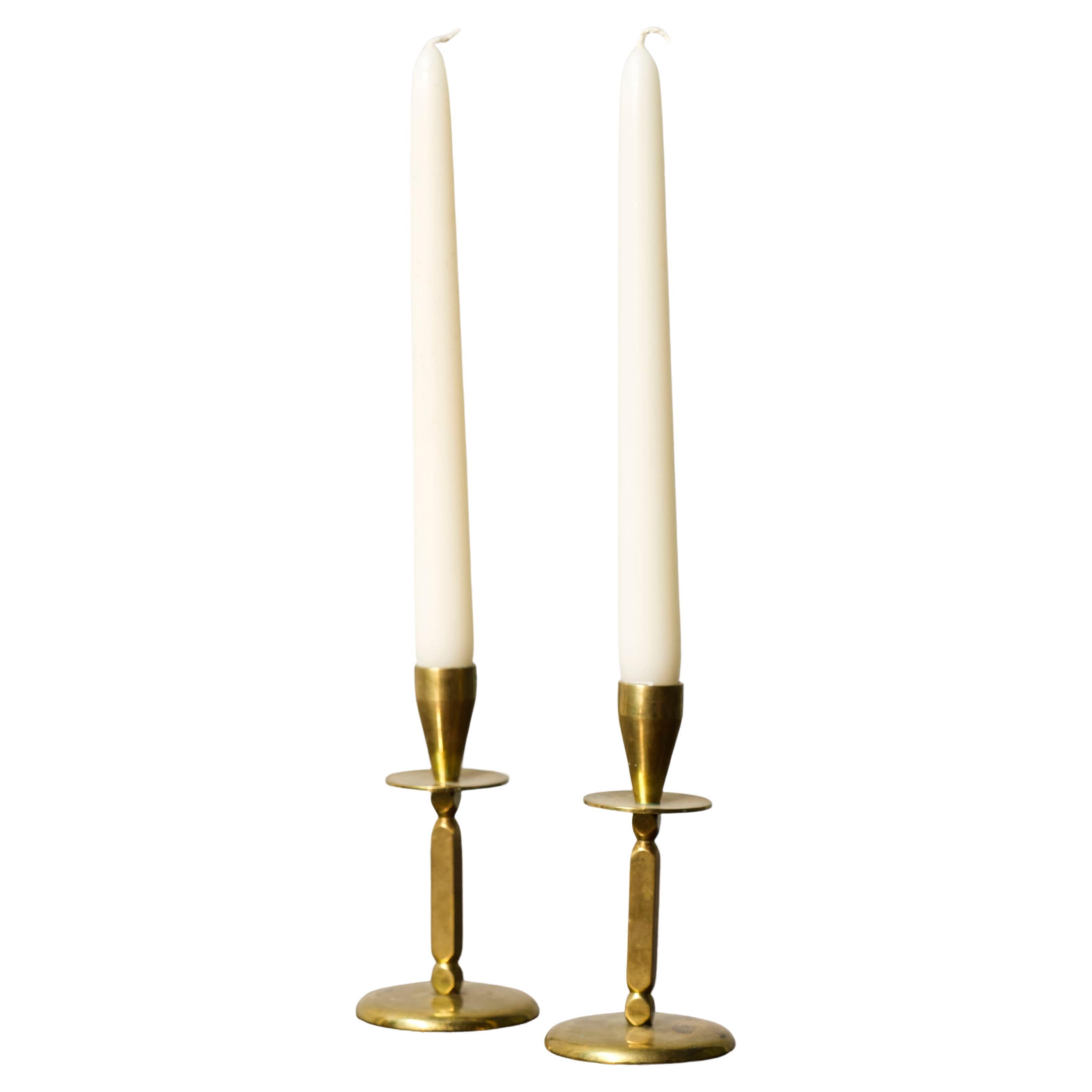 A pair of Mid century brass candle sticks, Kara Denmark