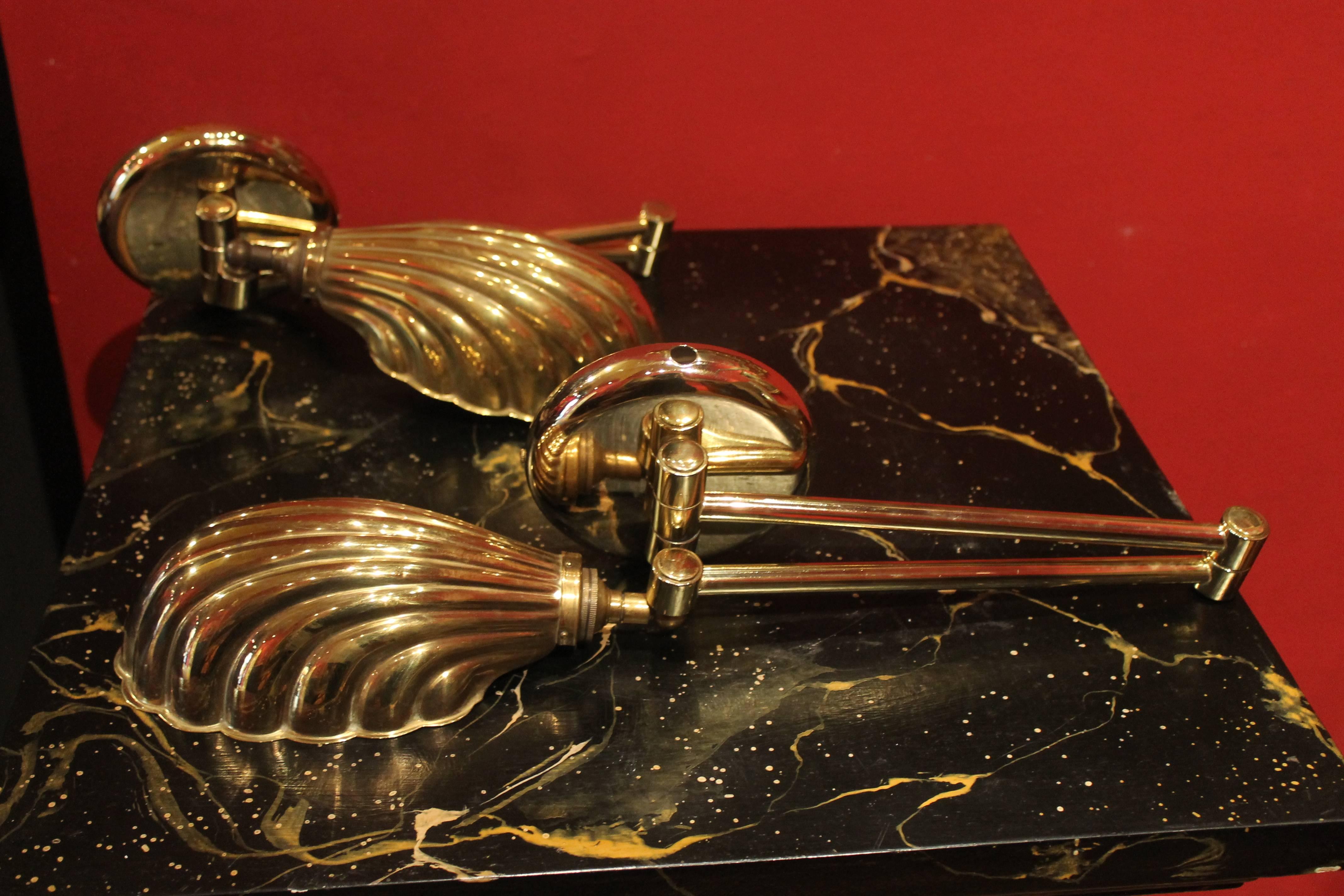 Mid-Century Modern Pair of Italian Gilt Brass Swing Arm Shell Sconces, circa 1950