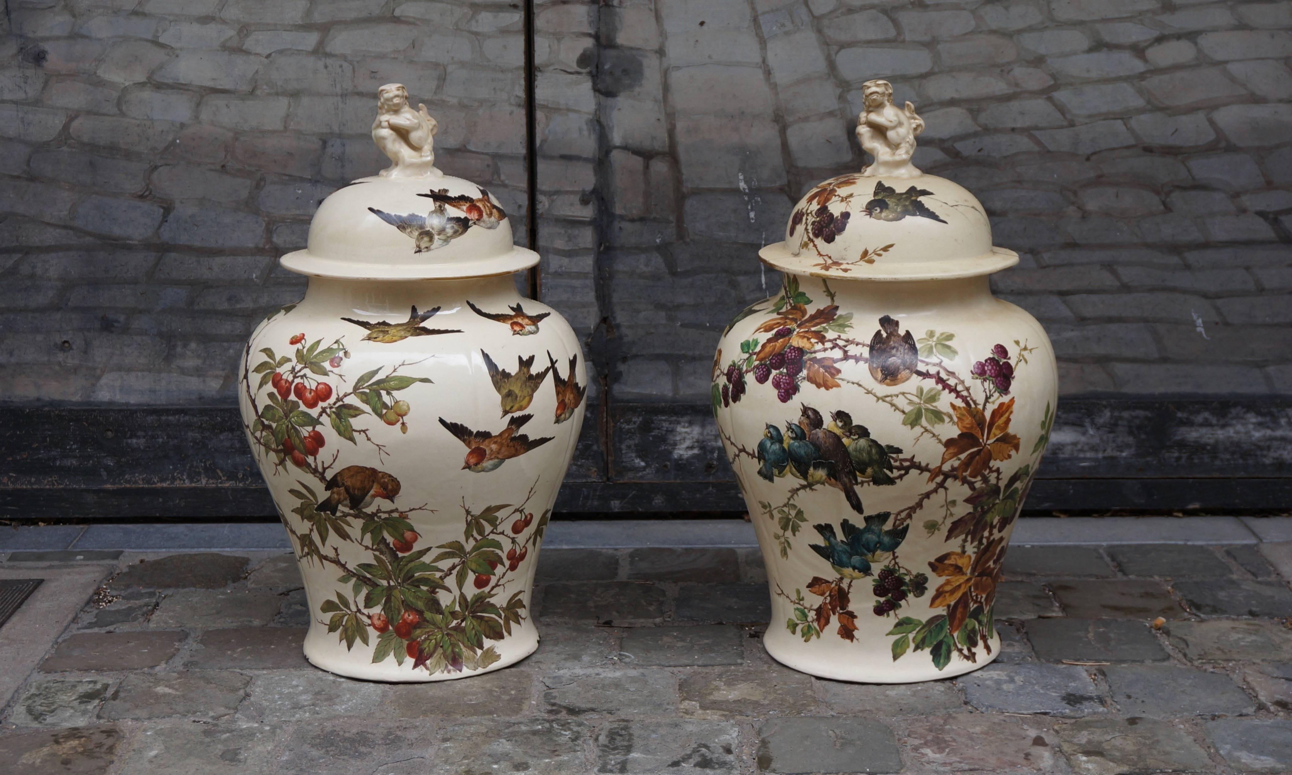 Large pair of meiping shape vases and covers with Foo Lion Finials painted by E Kilbert.
 French artist reknowned for his work at Longwy.