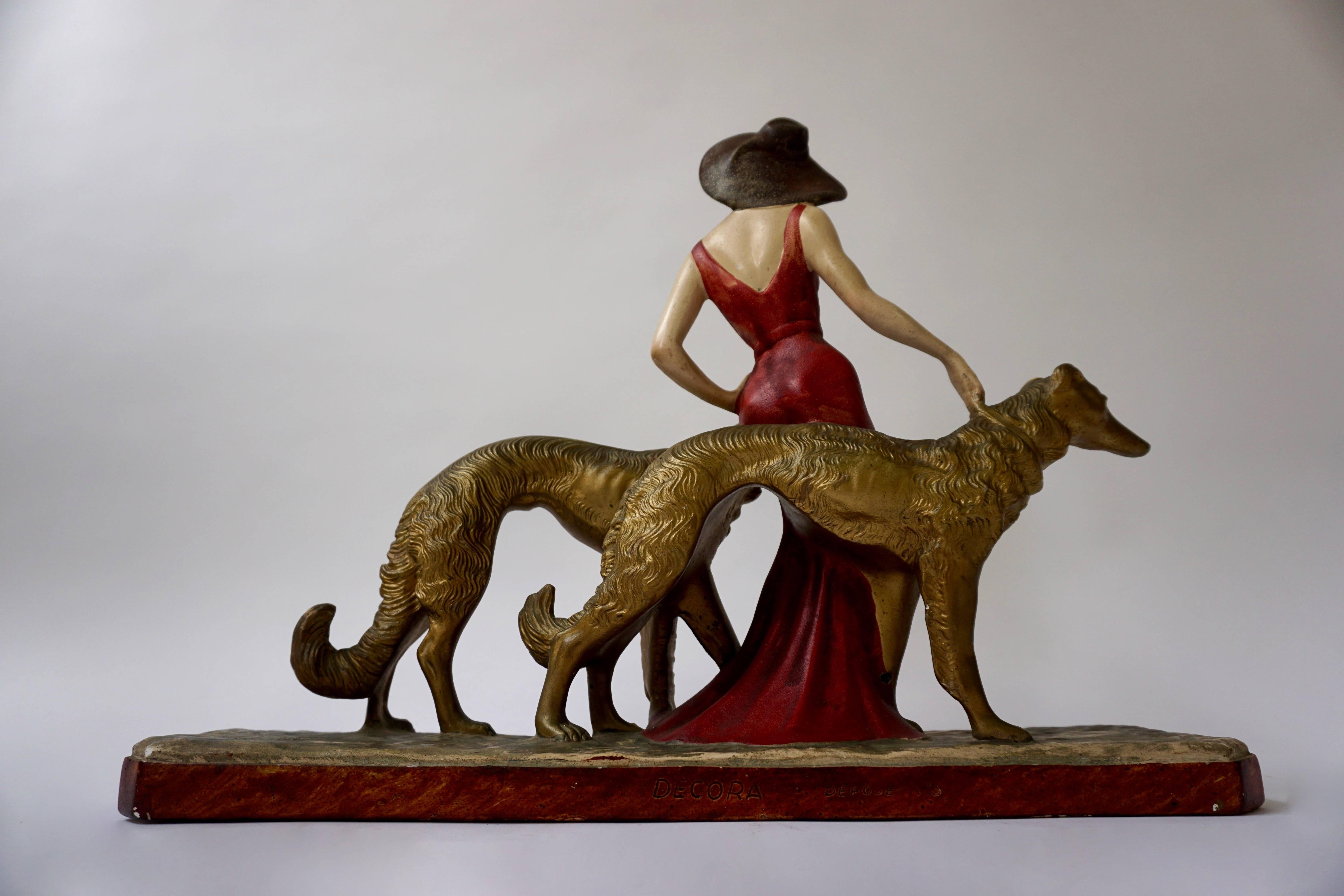 French Painted Plaster Art Deco Figure of a Lady Walking Her Two Greyhounds, circa 1930