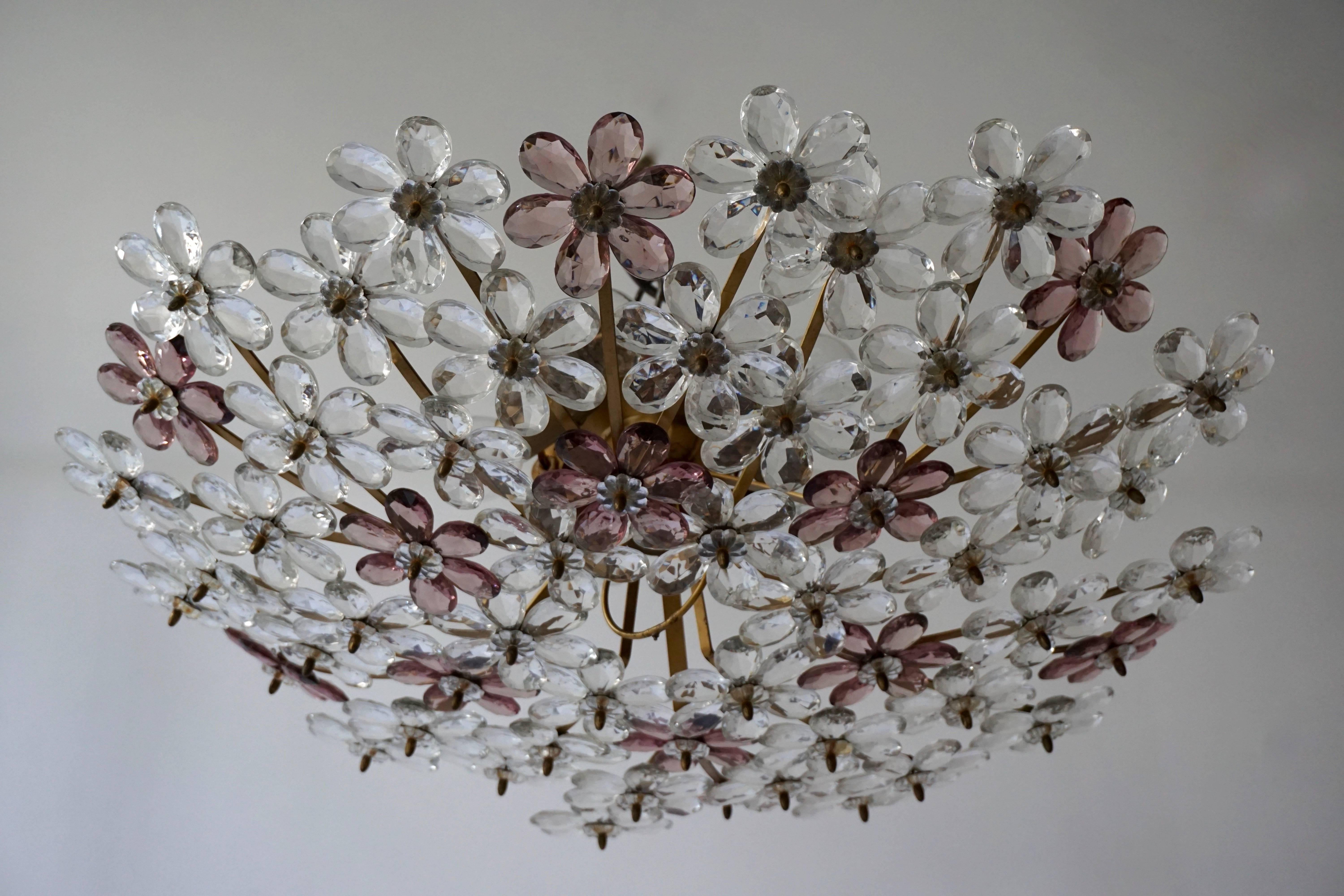 Two Italian glass and brass flush mounts or wall lights with 60 glass flowers.
Measures: Diameter: 65 cm.
Height:18 cm.
Five E14 bulbs.
 