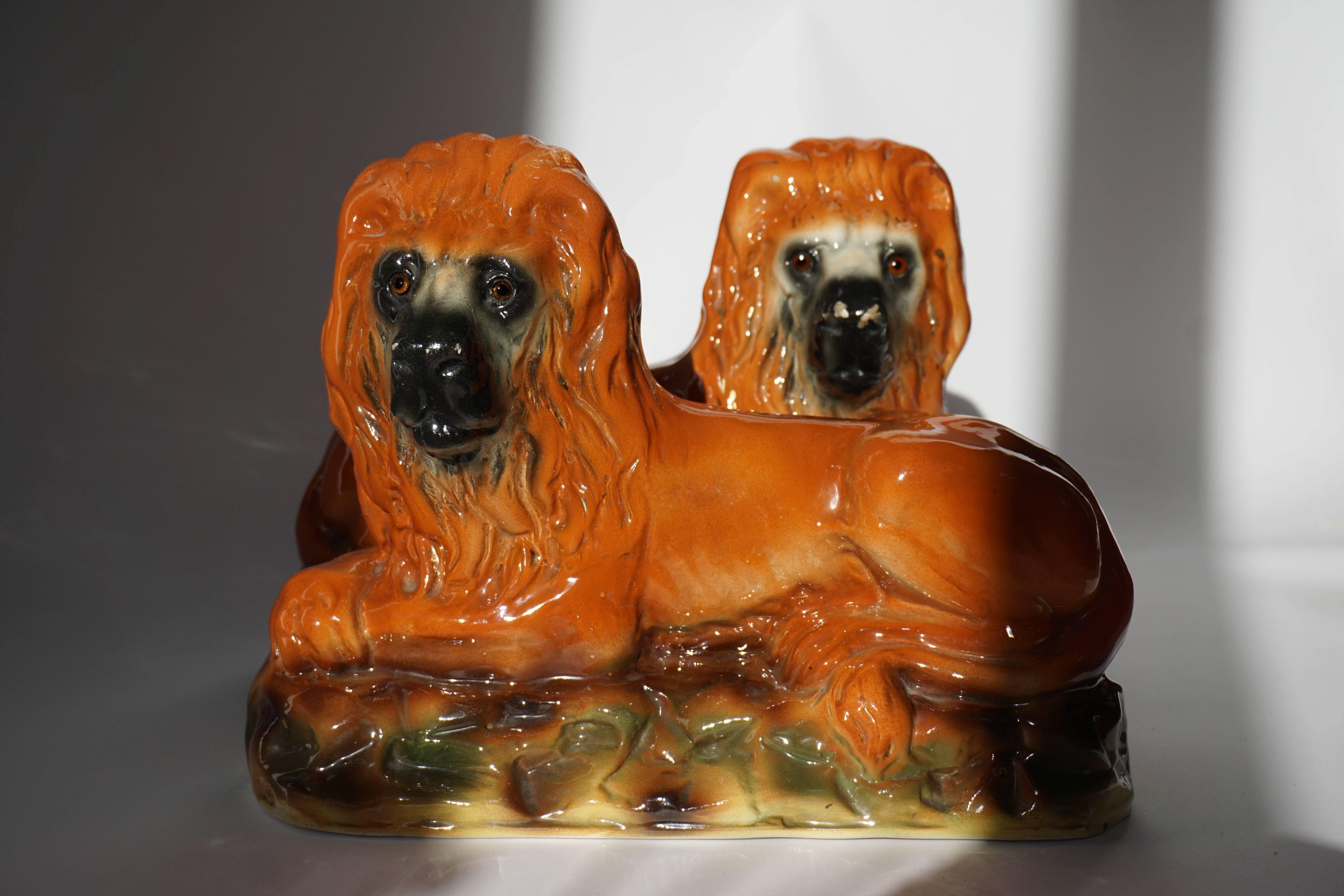 Set of two ceramic lions.