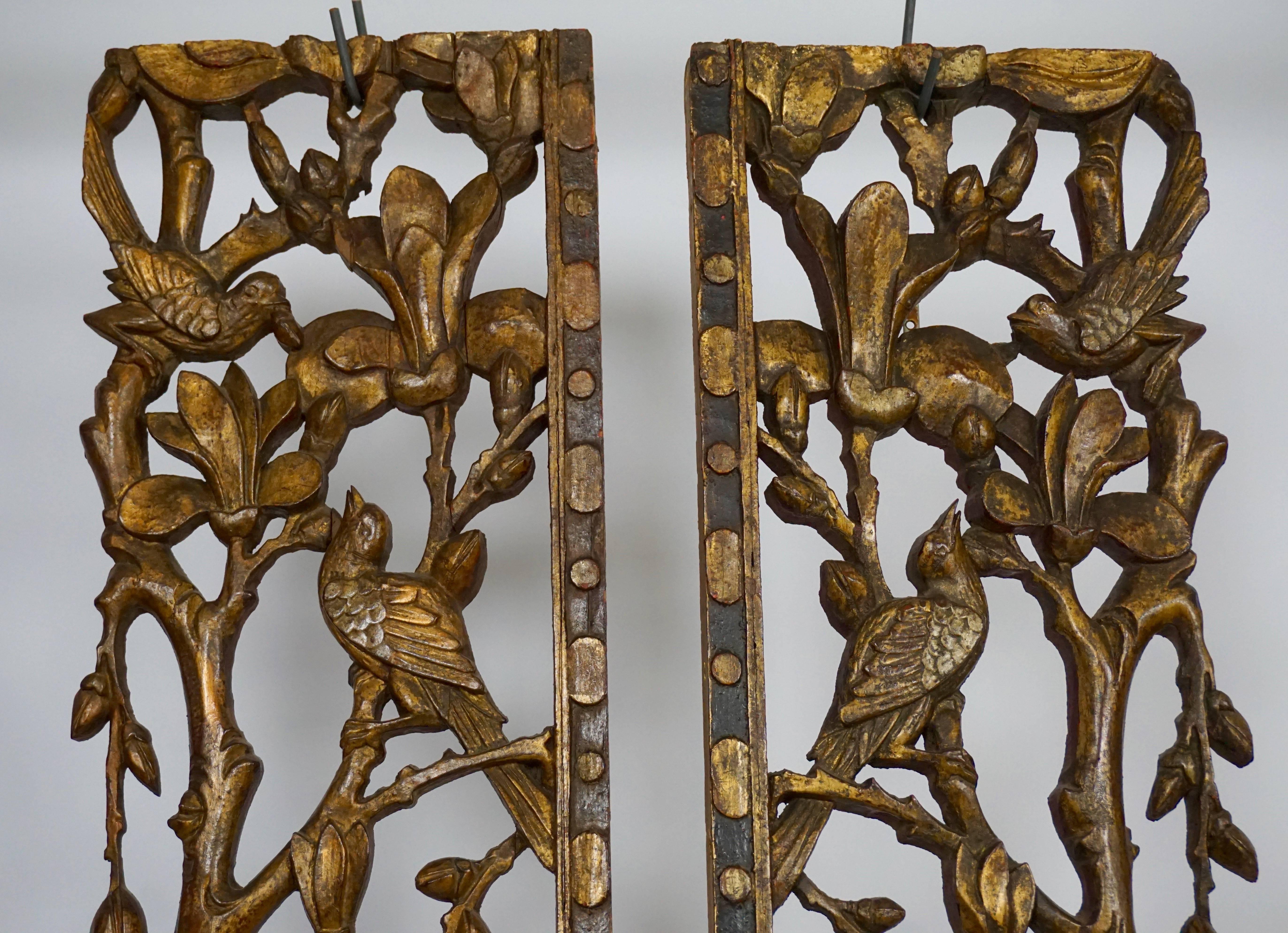 A pair of carved giltwood mandarin bed ornaments in the form of ‘ à jour ‘ – carved courting birds amidst flowering magnolia branches in spring time.
Chinese, 18th or early 19th century.
Measures: Height 165 cm,
width 30 cm,
depth 3 cm.